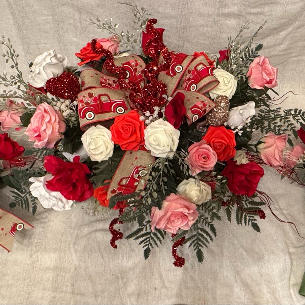 Memorial Day flowers. Grave memorial headstone saddle and two vases